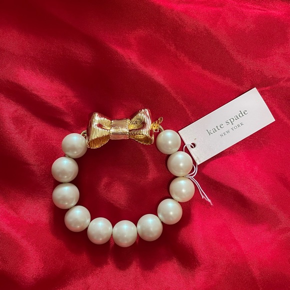 SOLD ON MERCARI!!
NWT-Kate spade gold ‘all wrapped up in pearls’ bow bracelet - Picture 1 of 4